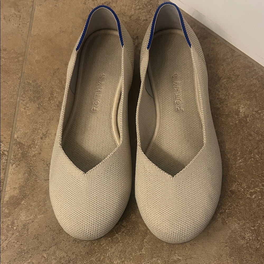 Rothy's Beige Women's Loafers with blue stripe on the heel.